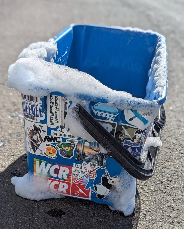 Window Cleaning Bucket with a bunch of stickers